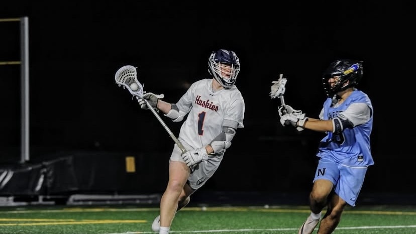Connor Ganschow brings the ball up the field against Nazareth